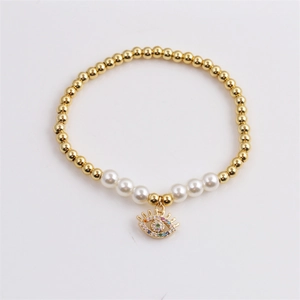 Evil Eye bracelet with gold beads, white pearls, and colorful crystal pendant