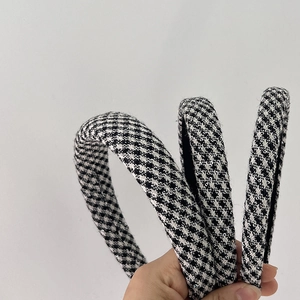 Three elegant black and white houndstooth headbands with sparkling sequins and sponge padding