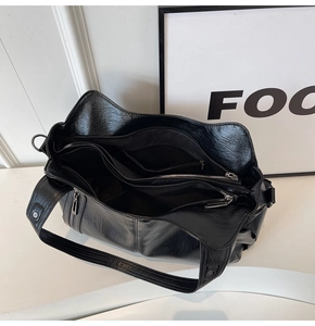 Macro view of the large capacity interior with multiple pockets and zipper compartment