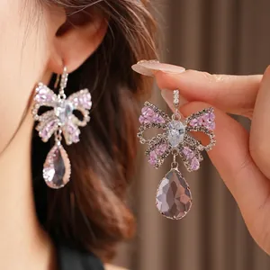Elegant bowknot water drop earrings with purple crystals and fine rhinestones