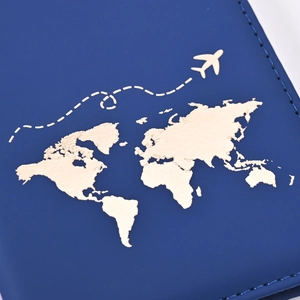 Detailed view of dark blue PU leather passport cover with golden world map and fine stitching