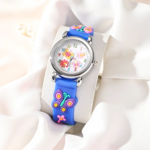 Detailed view of children's blue quartz watch with 3D butterflies on a silk background