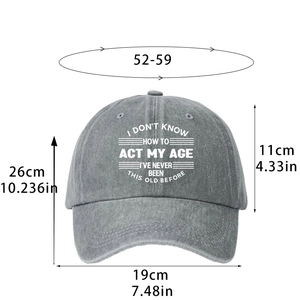 Gray washed denim baseball cap with white slogan and detailed sizing measurements