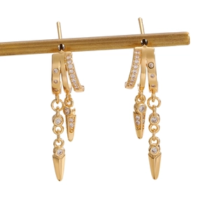 Golden fringe hoop earrings with zircon studs and arrow charms on white background