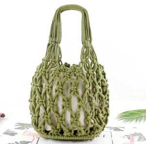 Detail of green handmade woven cotton rope handbag with bohemian mesh and inner lining
