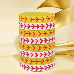 Detail of stacked yellow and white silicone wristbands with baseball red stitching texture