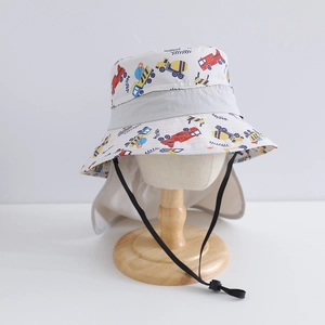 Detail of kids sun hat featuring cartoon trucks, large neck flap and adjustable chin strap