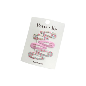 Five-piece wave edge hair clips set with floral and plaid patterns on display card