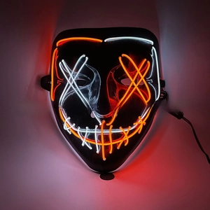 Close-up of LED Purge mask featuring orange and white glowing wires on a black frame
