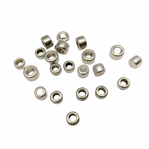 Scattered silver spacer beads for DIY jewelry making with smooth metallic finish