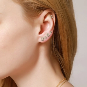 Chic gold plated letter S and BABY stud earrings with zircon stones on model