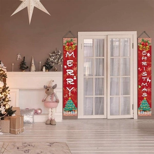 Detail of red Merry Christmas door banners with Santa and Snowman in festive home setting