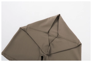 Close-up of brown ribbed yoga shorts featuring seamless high waist and reinforced stitching