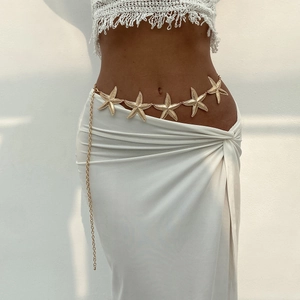 Sexy gold starfish body chain for beach vacations, featured on a female model