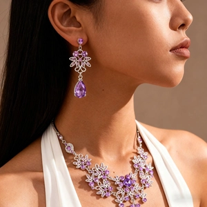 Vintage style floral necklace and teardrop earrings set with purple zircon gemstones