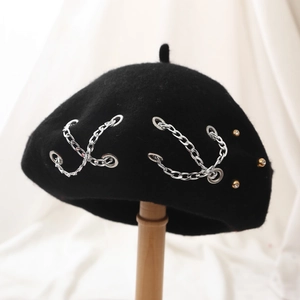 Black wool beret featuring a stylish silver metal chain and subtle stud accents