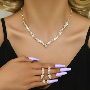 Elegant gold necklace and earrings set with sparkling crystals for formal weddings