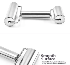 Detail of dual-head stainless steel rolling pin with brushed metal finish and U-shaped frame