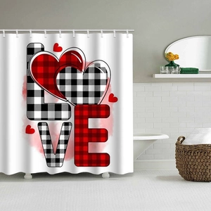 Detail of LOVE text and buffalo plaid heart patterns on waterproof polyester shower curtain