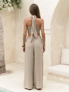 Detailed back view of oatmeal linen halter set showing strap tie design and texture
