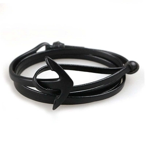 Close-up of multilayer black leather wrap bracelet with black anchor shaped hook clasp