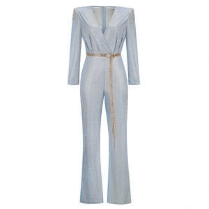 Elegant light blue sequined jumpsuit with V-neck, shoulder tassels and a gold chain belt
