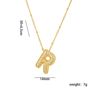 Detail view of 18K gold plated letter P pendant with micro-set cubic zirconia stones