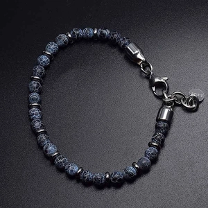 Detailed macro view of beaded map stone bracelet with stainless steel lobster clasp