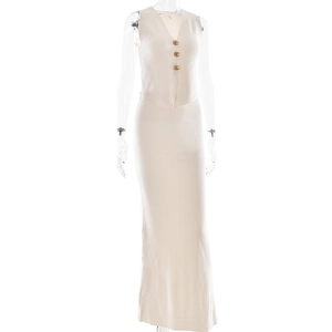 Detail of elegant cream knitted two-piece set featuring V-neck vest with gold buttons