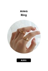 Detail of elegant gold double-layered ring with delicate pearls and minimalist open design
