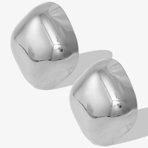 Macro detail of silver geometric square earrings with polished stainless steel surface