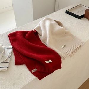 Close-up of premium wool label on thick oil painting style cashmere feel scarves