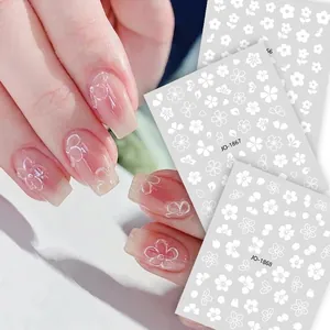 3D white floral nail stickers featuring embossed ice flower and cherry blossom patterns