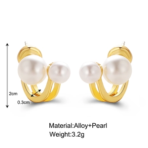 Detail view of U-shaped gold alloy earrings featuring dual pearls with 2cm height dimensions