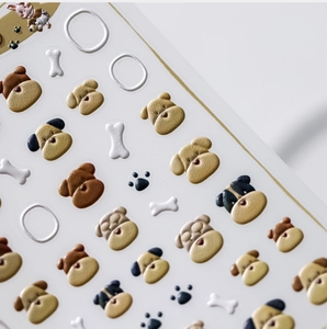 Détail macro de stickers 3D pour chiens avec motifs texturés de corgi et pattes