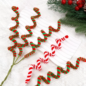Spiral Christmas candy cane sticks in red, green and white for festive tree decoration