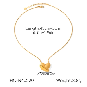 Flat lay of gold heart necklace showing length 43cm plus 5cm extension and 8.8g weight