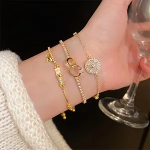 Three-piece gold plated adjustable bracelet set with cubic zirconia and clover charm