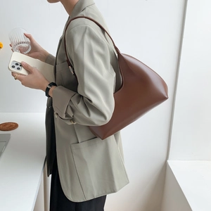 Minimalist brown PU leather crescent shoulder bag for women with sleek Korean style design