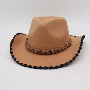 Detail of khaki felt cowboy hat with ethnic beaded band and black scalloped edge trim