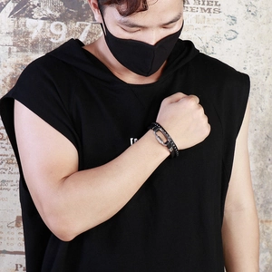 Men's multi-layer woven black leather bracelet with silver metal clasp on wrist