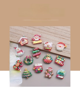Detailed collection of shiny resin Christmas charms including Santa, snowmen and gingerbread men