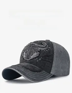 Close-up of vintage distressed baseball cap with bull skull embroidery and frayed edges