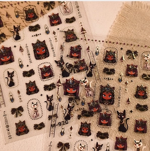 Detail showing Egyptian cat and goddess nail stickers with golden outlines and retro symbols