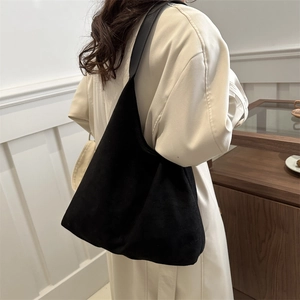 Minimalist black suede hobo shoulder bag with large capacity shown on model