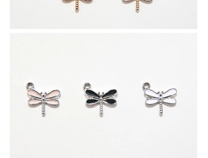 Close-up of colorful enamel dragonfly pendants for DIY jewelry making and bracelets
