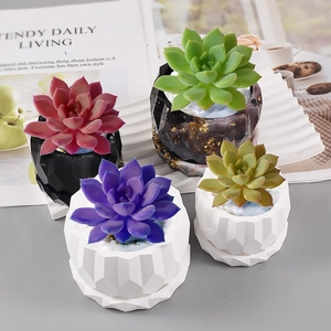 Set of 4 geometric succulent pots in black, white, and marble finish with matching trays