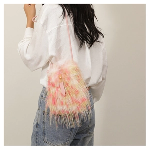 Detail of pink and yellow gradient faux fur bag with thin strap and metal buckle