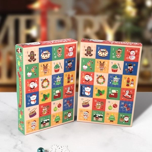 24-day Christmas advent calendar box with festive holiday prints on a marble surface