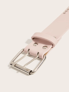 Detail view of pink leather punk belt with double silver grommets and metal rivets